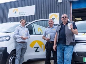 Zetetick Housing maintenance and support staff pictured with one of the organisation's branded vans.